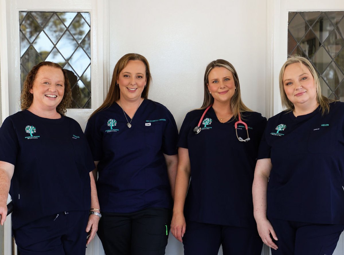 Janelle Eleftheriadis, Dr Danielle Crosby, Dr Jaya Lindsay and Helen Partridge, the four owners, in navy scrubs.